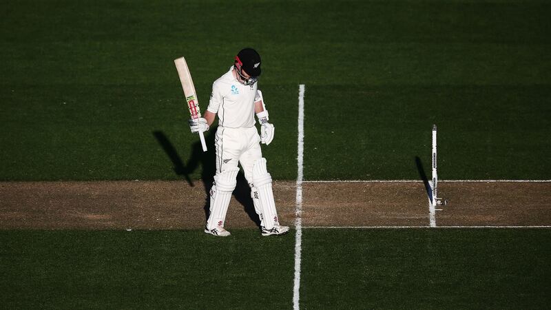 Kane Williamson of New Zealand acknowledges reaching his half century. Photograph: Anthony Au-Yeung/Getty