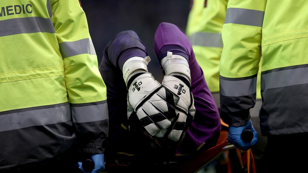 Republic of Ireland goalkeeper Rob Elliot leaves the field with an injury on Tuesday night. Photograph: Ryan Byrne/Inpho