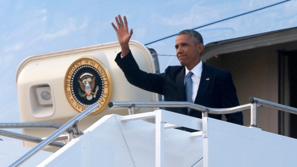 President Barack Obama waves as he arrives on Air Force One to attend the NATO Summit in Wales. Photograph: AP Photo/Charles Dharapak