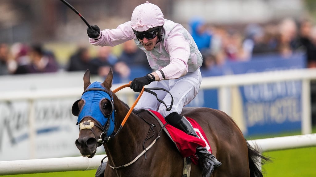 Barry Browne, on board Swamp Fox, celebrates as he crosses the line to win at the   Galway Festival. Photograph: Ryan Byrne/Inpho