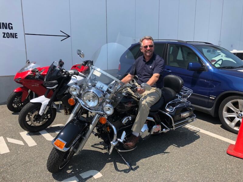 John Cotter enjoying the sun on his Harley in Melrose, MA.