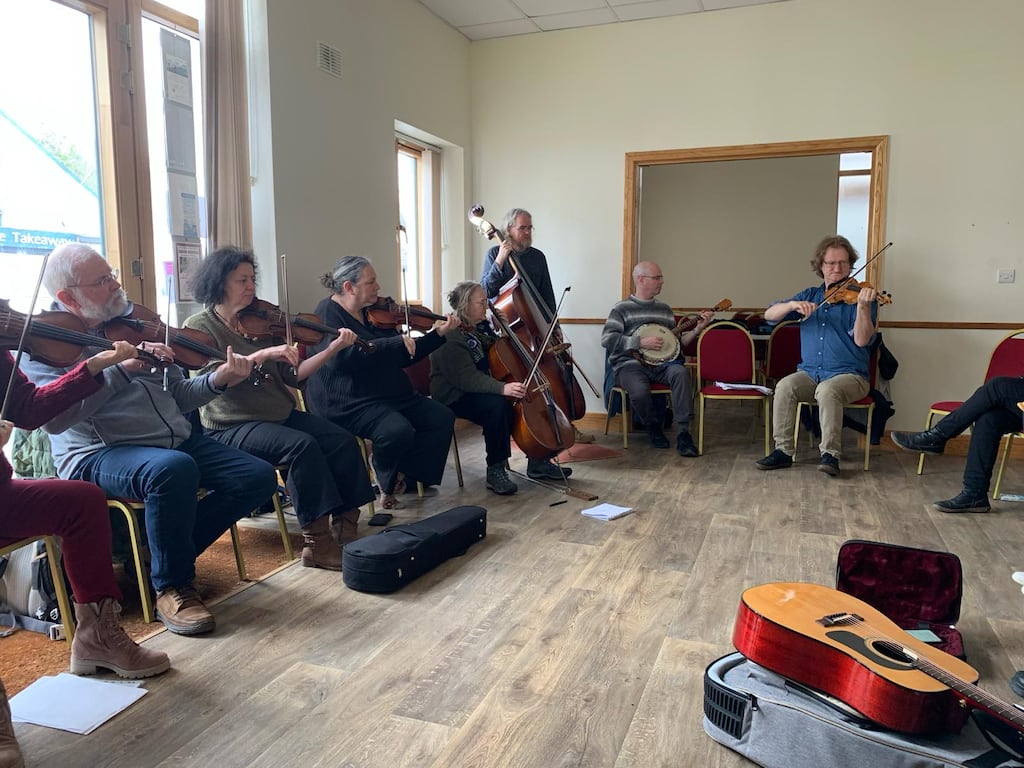 Wouter Vandenabeele, right, with his students in the parish hall in Roundwood, Co Wicklow
