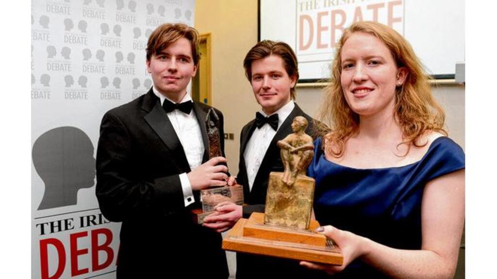 Irish Times debate winners Kate Brady (TCD Hist) with Liam Brophy and John Engle from the TCD Bram Stoker club. photograph: charles mcquillan/pacemaker