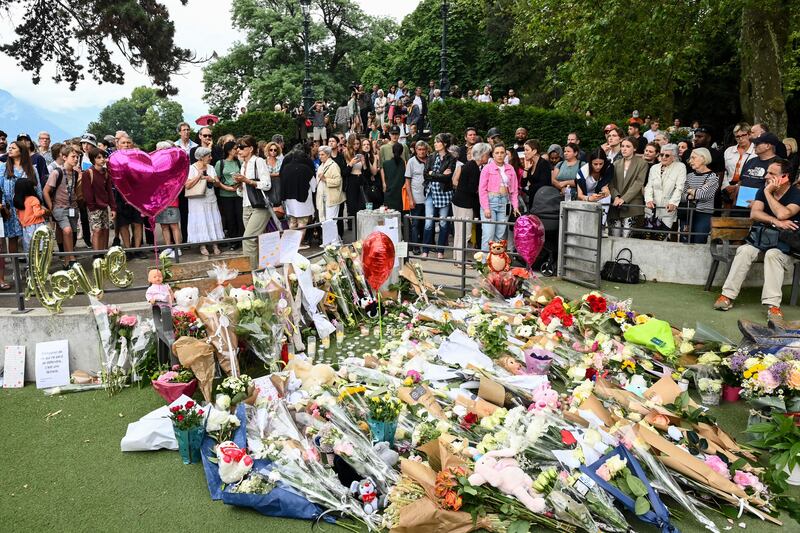 People gather to lay flowers for the victims of the attack in the Jardins de l'Europe park in Annecy on June 9th. Photograph: Olivier Chassignole/AFP via Getty