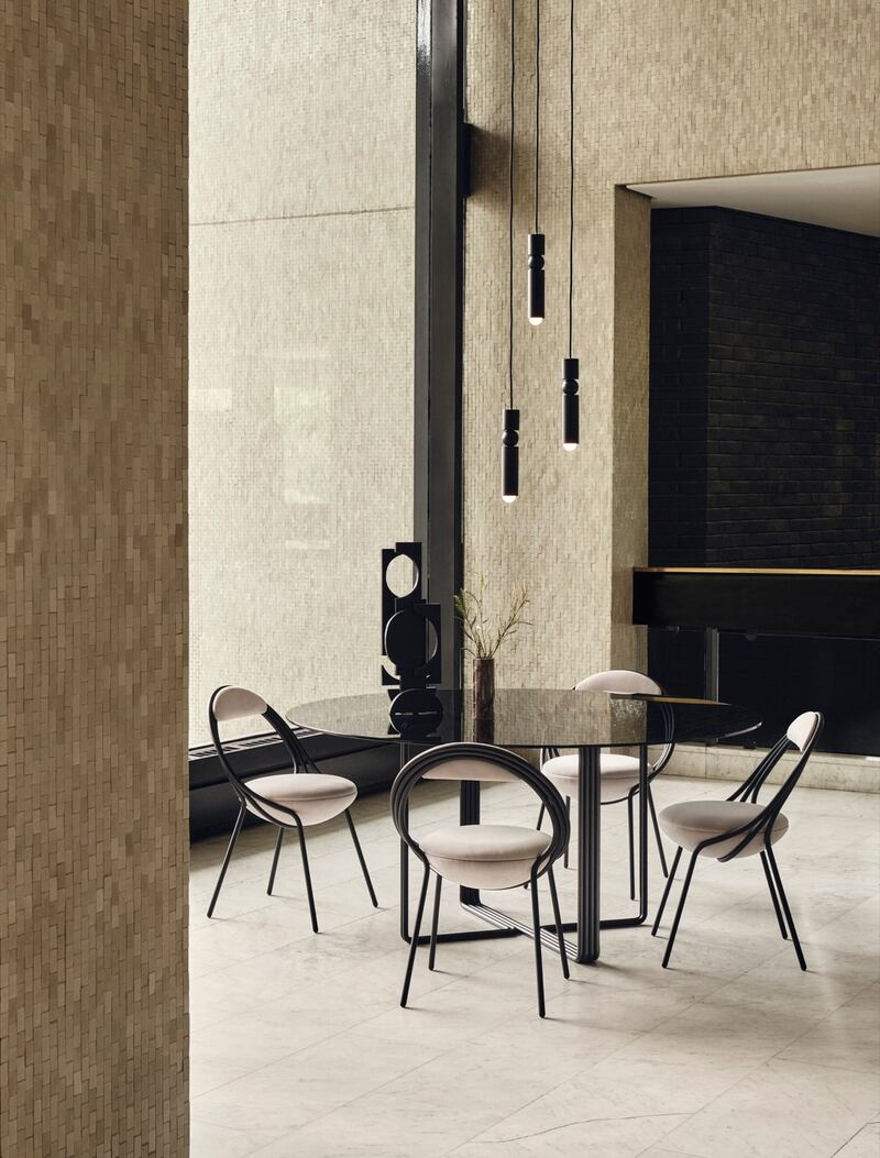 Musico, from Lee Broom, is a glass-topped pedestal dining table, about €6,975, and matching chairs, from about €1,026 each, ex delivery