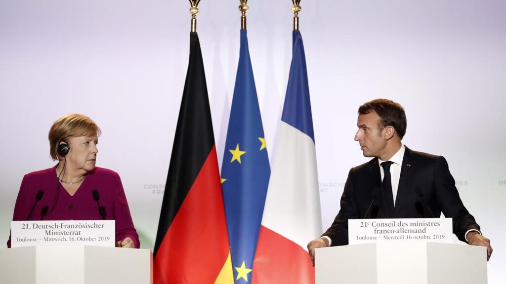 German chancellor Angela Merkel and French president Emmanuel Macron hold a press conference in Toulouse. Photograph: Guillaume Horcajuelo/EPA