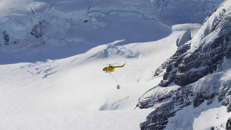 A helicopter distributes bait over an ice cap in South Georgia. Photograph: Tony Martin/PA Wire