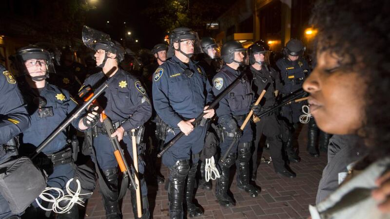 Police officers square off against protesters during a protest against police violencein Berkeley, California. Photograph: Noah Berger/Reuters