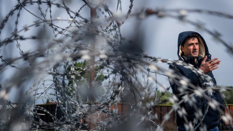 A refugee on the Serbian side of the border at Hungary’s southern border with Serbia near Tompa. Photograph: Sandor Ujvari/EPA