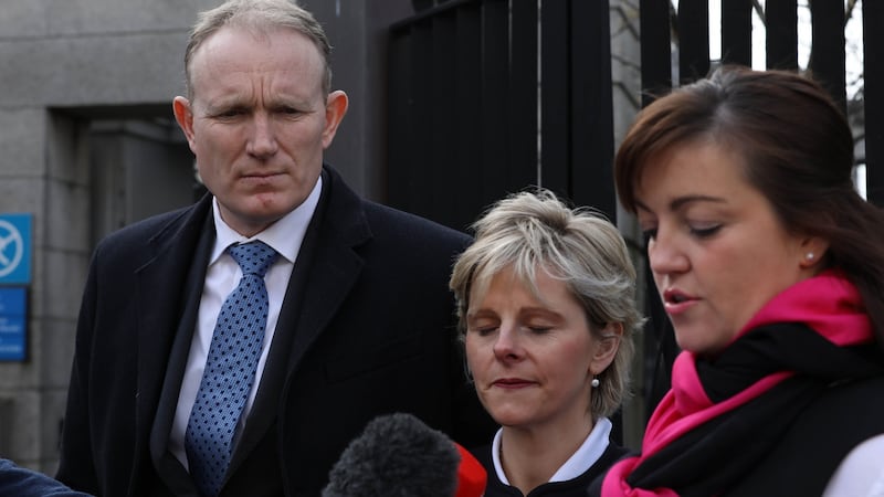 Gerard and Mary Costello, parents of Tadgh Costello with their solicitor Susie Elliott outside the Four Courts on Tuesday. Photograph: Collins Courts