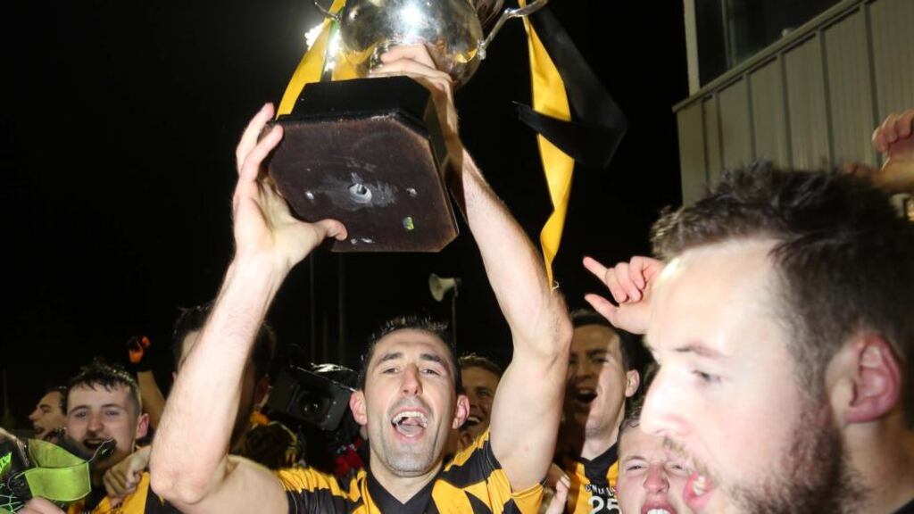 St Eunan’s Rory Kavanagh lifts the Dr Maguire Cup after the Donegal county final. Photograph: Inpho/Presseye/Lorcan Doherty