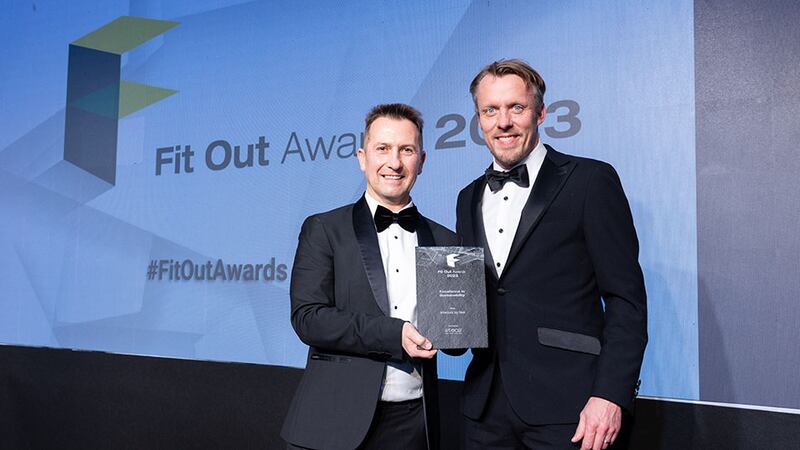 Stephen Pierce, Irish agent at 2tec2, presents the excellence in sustainability award to Mark Tiernan, Interiors by Sisk