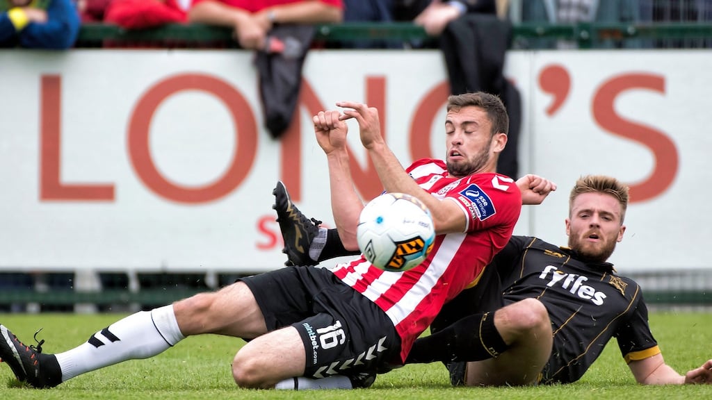 Derry’s Nathan Boyle is challenged by Dundalk’s Conor Clifford. Photograph: Evan Logan/Inpho