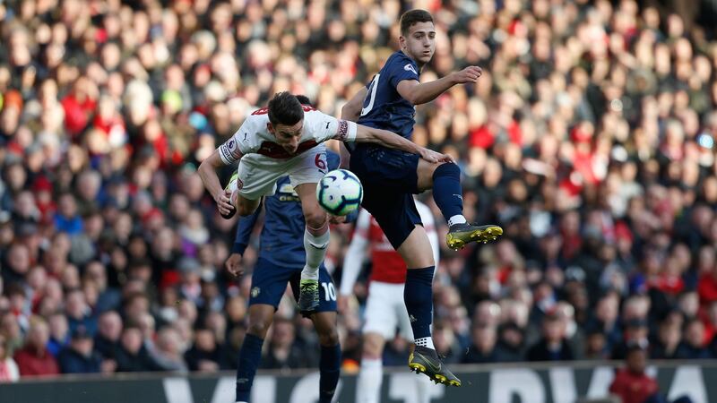 Koscielny and Dalot compete for the ball. Photo: Ian Kington/Getty Images
