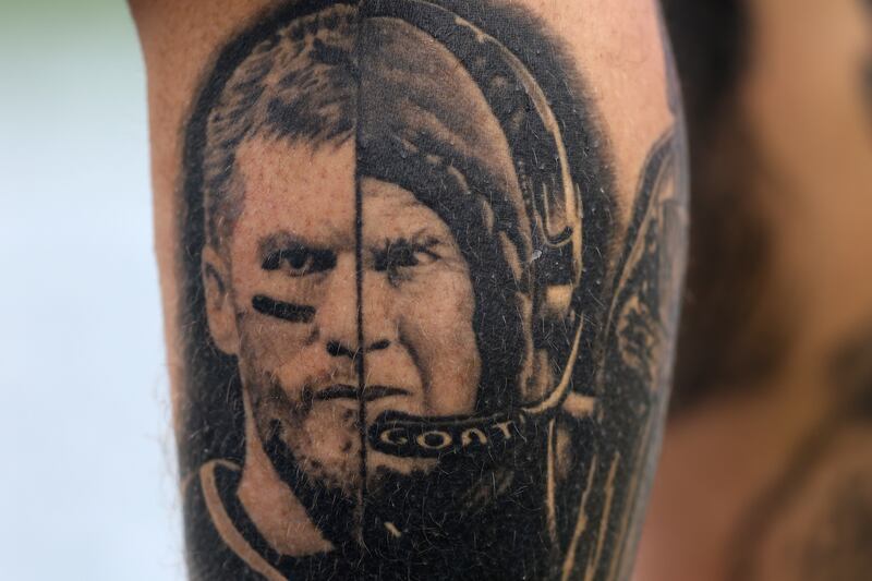 A tattoo of former New England Patriots quarterback Tom Brady and head coach Bill Belichick of the New England Patriots on a New England Patriots fan before their game against the Philadelphia Eagles. Photograph: Adam Glanzman/Getty