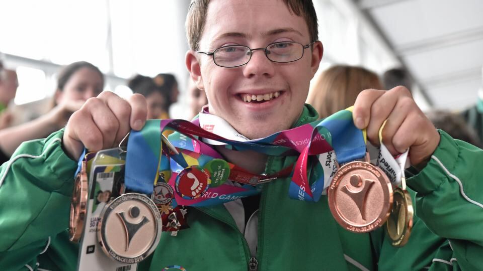 Team Ireland’s Liam Foley, from Killyon, Co Meath, displays four medals he won for badminton at Dublin Airport during the homecoming. Photograph: Cody Glenn/Sportsfile
