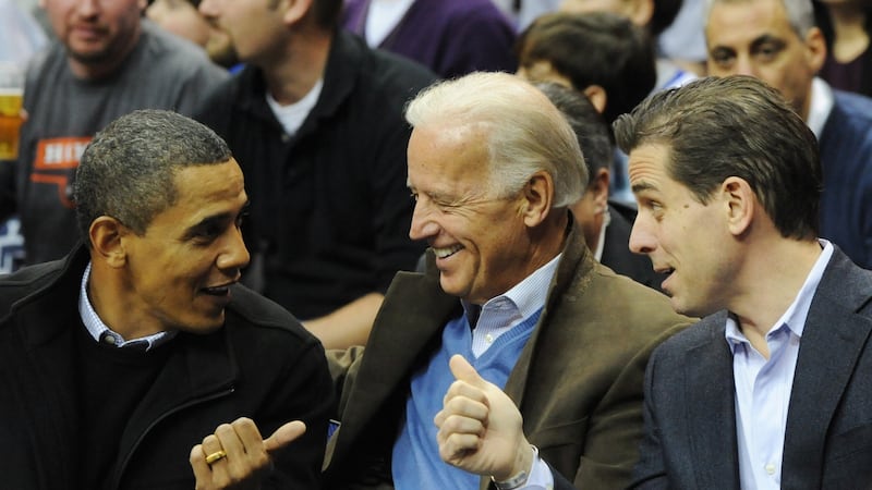 Then US president Barack Obama greets vice president Joe Biden and his son Hunter at a college basketball game in Washington in January 2010. Photograph: Alexis C Glenn/EPA