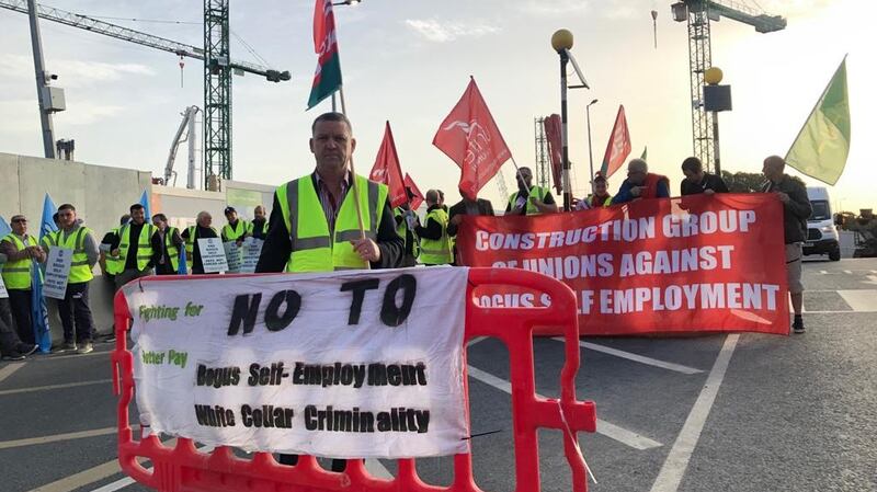 Construction workers picketing the new national children’s hospital on Friday as part of a protest over alleged “bogus work practices” on the site.