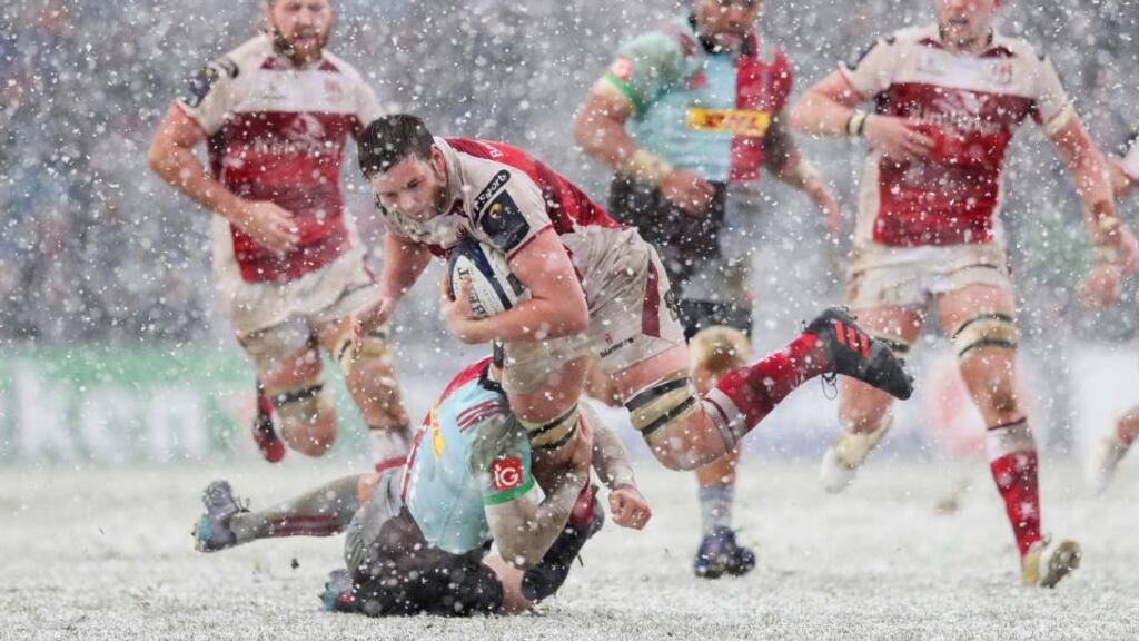 Ulster captain Iain Henderson is tackled by Tim Visser. Photograph: Ryan Byrne/Inpho