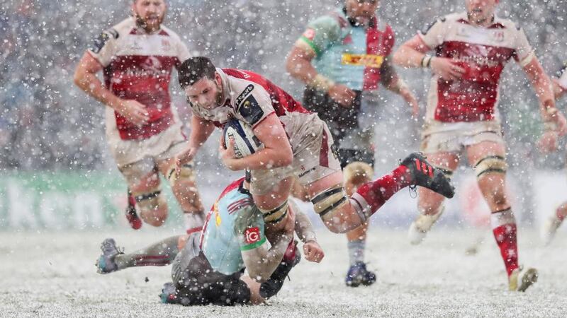 Ulster captain Iain Henderson is tackled by Tim Visser. Photograph: Ryan Byrne/Inpho