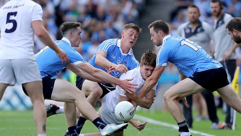 Kildare’s Kevin Feely is tackled by Dublin’s Brian Fenton, Con O’Callaghan and Dean Rock at Croke Park. Photograph: Oisin Keniry/Inpho