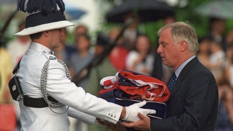 Last governor: Chris Patten receives the Union Jack after it was lowered over Hong Kong for the final time, on June 30th, 1997. Photograph: Emmanuel Dunand/AFP/Getty