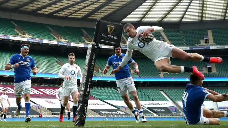 Jonny May dives over Luca Sperandio to score against Italy. Photograph: David Rogers/Getty