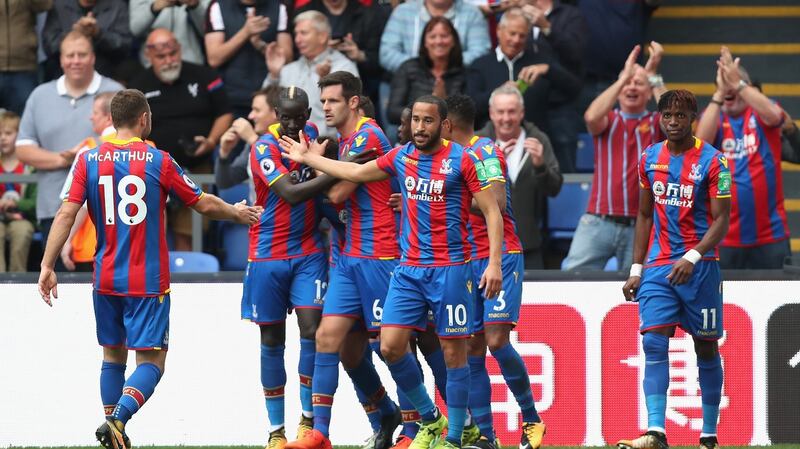 Crystal palace celebrate their first goal of the season against Chelsea. Photograph: Dan Istitene/Getty