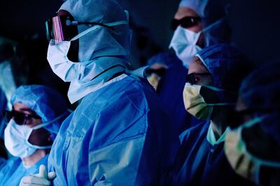 Surgeons observing the operation on Ms Roy.