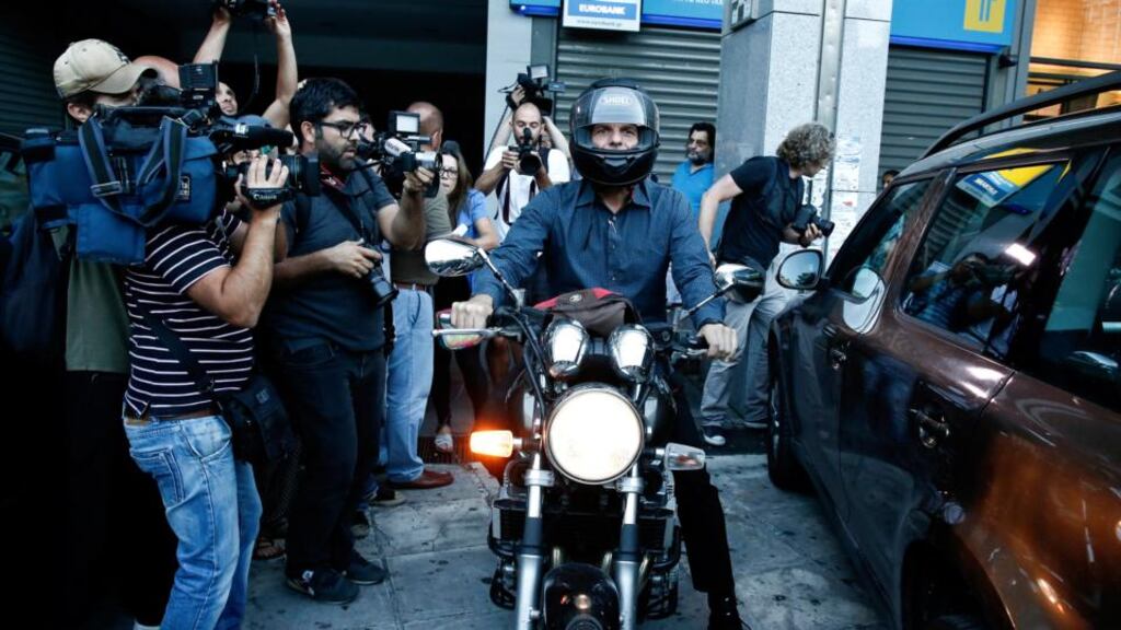 Yanis Varoufakis, Greece’s finance minister, leaves the finance ministry in Athens on Wednesday. He says he will resign if the voters back a Yes in referendum on Sunday. Photograph: Yorgos Karahalis/Bloomberg