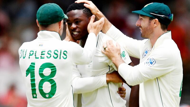 Kagiso Rabada is congratulated by South Africa captain Faf du Plessis after taking the wicket of Dom Sibley. Photograph: Ashley Vlotman/Gallo Images/Getty Images