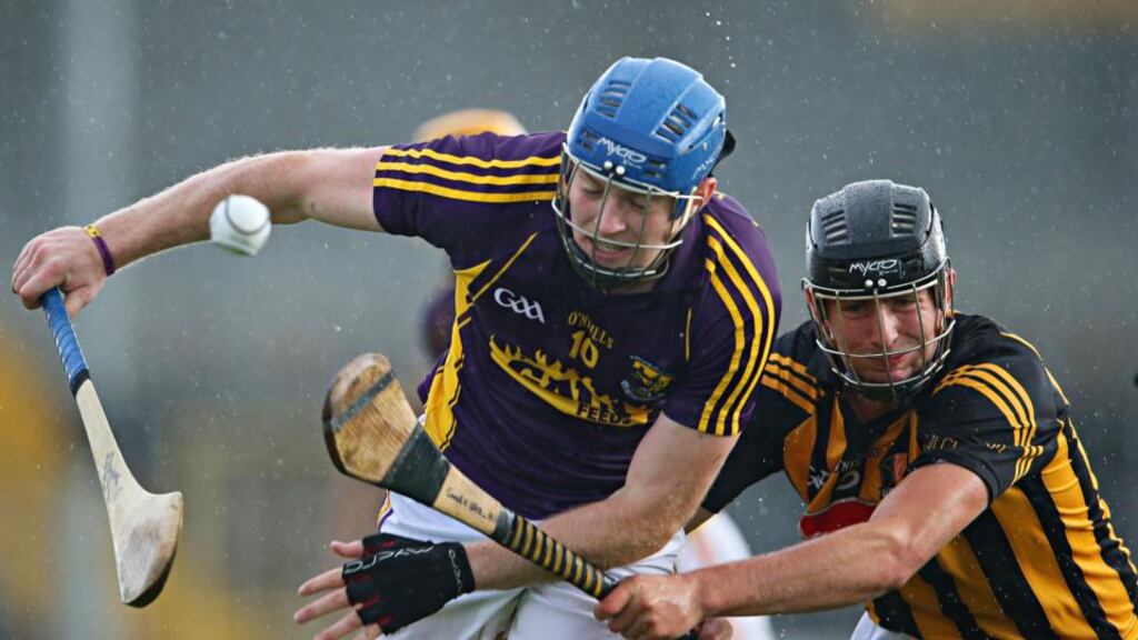 Kilkenny’s Conor O’Shea tries to tackle  Jack Guiney of Wexford during their Under-21 hurling  quarter-final at Nowlan Park, Kilkenny. Photograph: Inpho