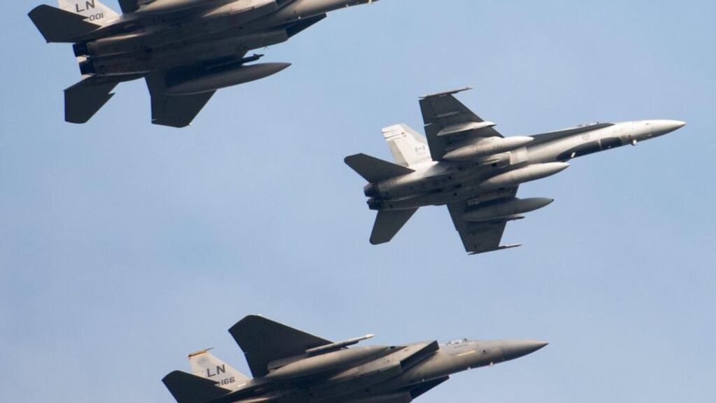 Two Russian Mig-31 fighter jets and two Russian Bear long-range bombers were intercepted in the ADIZ, west of Alaska. File photo: Canadian McDonnell Douglas CF-18 Hornet fighter jet (centre) and two US McDonnell Douglas F-15 Eagle jets. Credit: Maurizio Gambarini/EPA