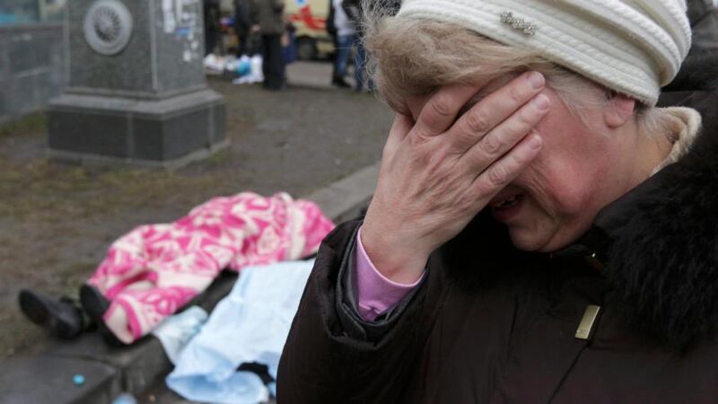 A Ukrainian opposition activist throws a tyre to feed burning fire barricade after cruel clashes with riot police earlier today in Kiev. Photograph: EPA/Igor Kovalenko