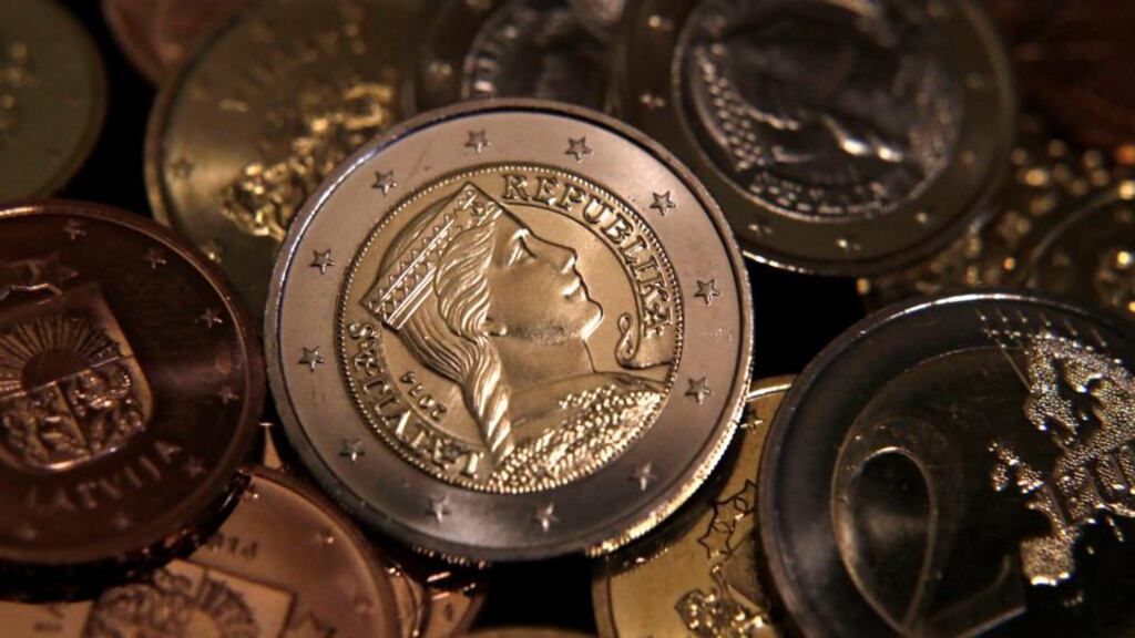 Latvian euro coins. Latvia will join the euro zone on January 1st, 2014. Photograph: Ints Kalnins/Reuters