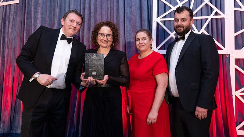 Graham Harding, sales director, Noyeks Newmans presents the green architectural practice of the year to the Helena McElmeel Architects team