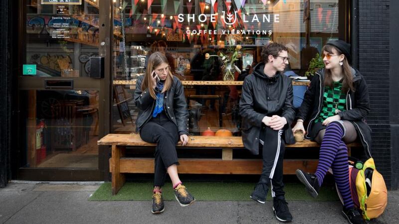 Relaxing outside Shoe Lane. ‘We get cool young customers, but we get suits too – everybody, all ages.’ Photograph: Tom Honan
