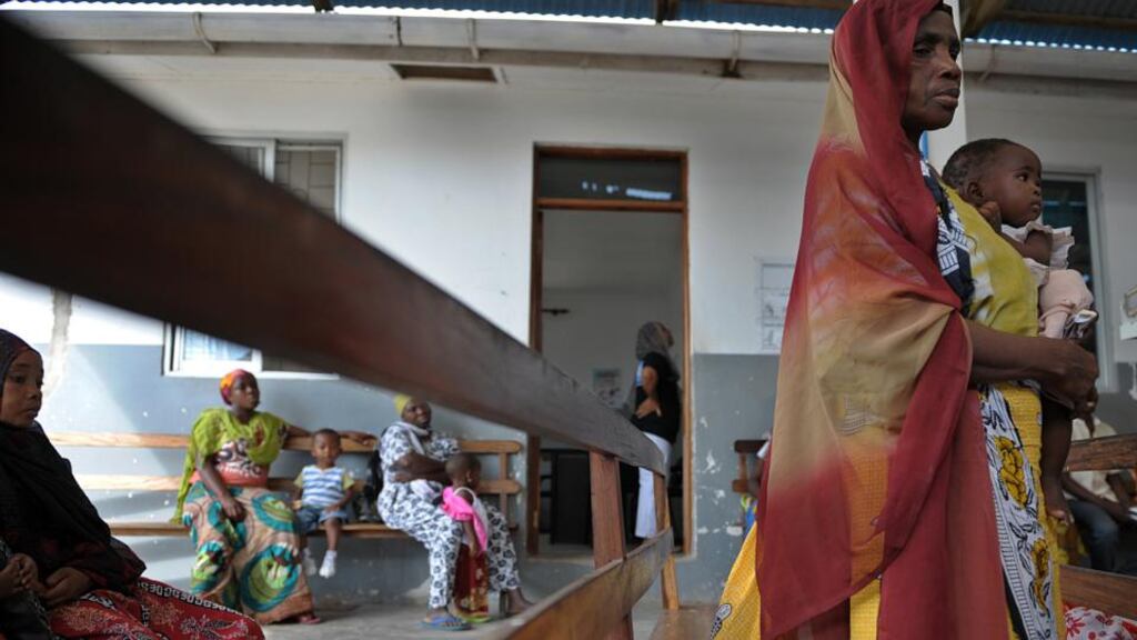 Mothers wait with their children in Bagamoyo, Tanzania, during tests for a vaccine against malaria. Researchers have said that final clinical trials of a possible world-first licensed vaccine for the disease suggest the jab has the ‘potential to prevent millions of cases’. Photograph: Tony Karumba/AFP/Getty Images