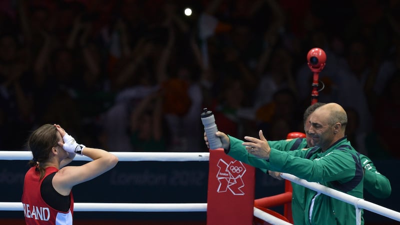 Katie Taylor walks towards her father Pete after winning the lightweight final at the 2012 London Olympics. Photograph: Alberto Pizzoli/AFP/Getty Images