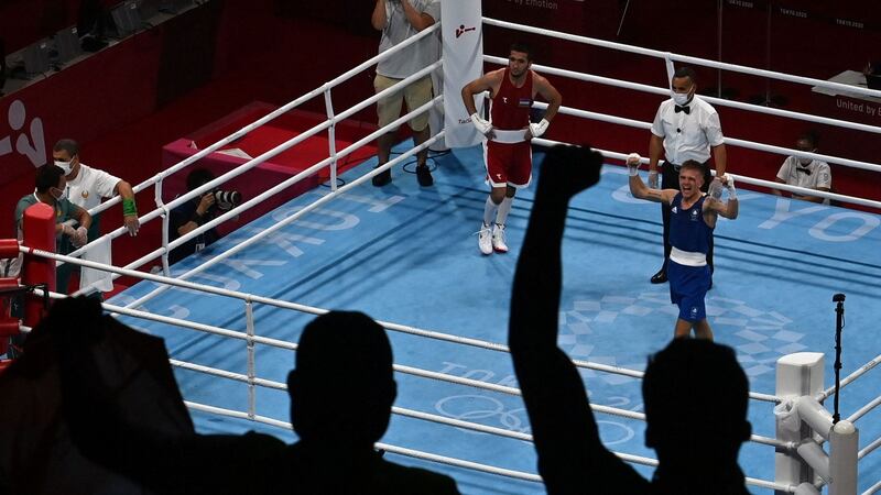 Kurt Walker celebrates after winning against Mirazizbek Mirzakhalilov. Photo: Luis Robayo/AFP via Getty Images