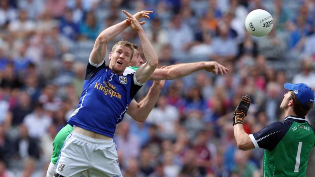 Paul Gerarghty of London gets in behind Rory Dunne of Cavan to score the first goal of the game at Croke Park. Photograph: Donall Farmer/Inpho