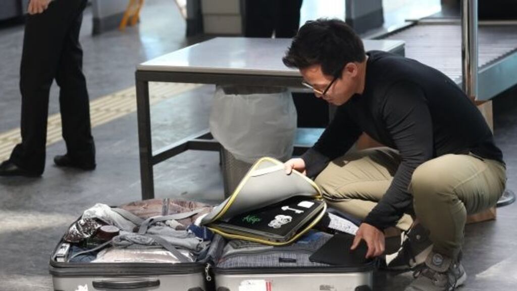 A man opens his luggage and to show his electronic equipment at security point at the Ataturk Airport in Istanbul, Turkey. The United States and Britain have banned some electronic devices from carry-on baggage on flights coming from a number of countries. File Photograph: Sedat Suna/EPA.