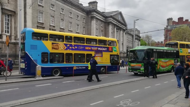 Luas services are suspended between St Stephen’s Green and Dominic as the bus is blocking the tram tracks outside Trinity College. Photograph: Dean Ruxton