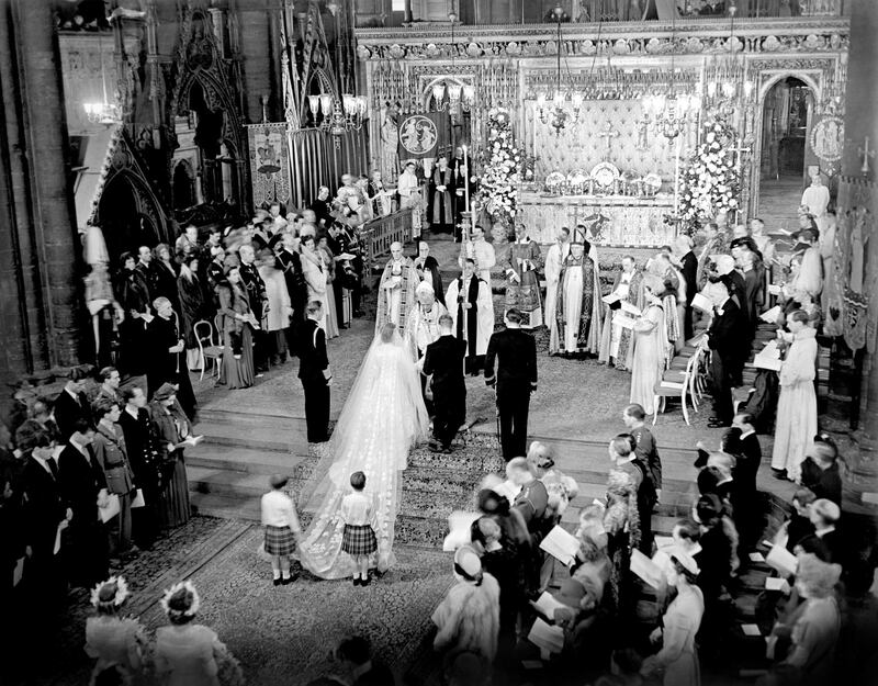 The royal wedding ceremony of Princess Elizabeth and the Duke of Edinburgh in Westminster Abbey in1947. King George II stands to the left of the bride; on the bridegroom's right is the groomsman, the Marques of Milford Haven. The bride's train is held by two pages Prince William of Gloucester and Prince Michael of Kent. Photograph: PA