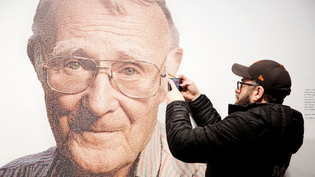 A visitor to the Ikea museum in Almhult, Sweden, takes a photo of a portrait of the late Ingvar Kamprad, founder of Swedish multinational furniture retailer Ikea, today. Photograph: Ola Torkelsson/TT News Agency/Reuters