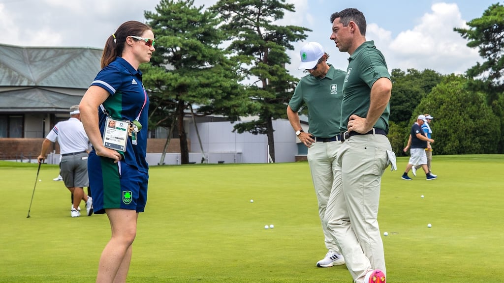 Ireland’s Leona Maguire speaks to Rory MIlroy on Sunday. Photo: James Crombie/Inpho