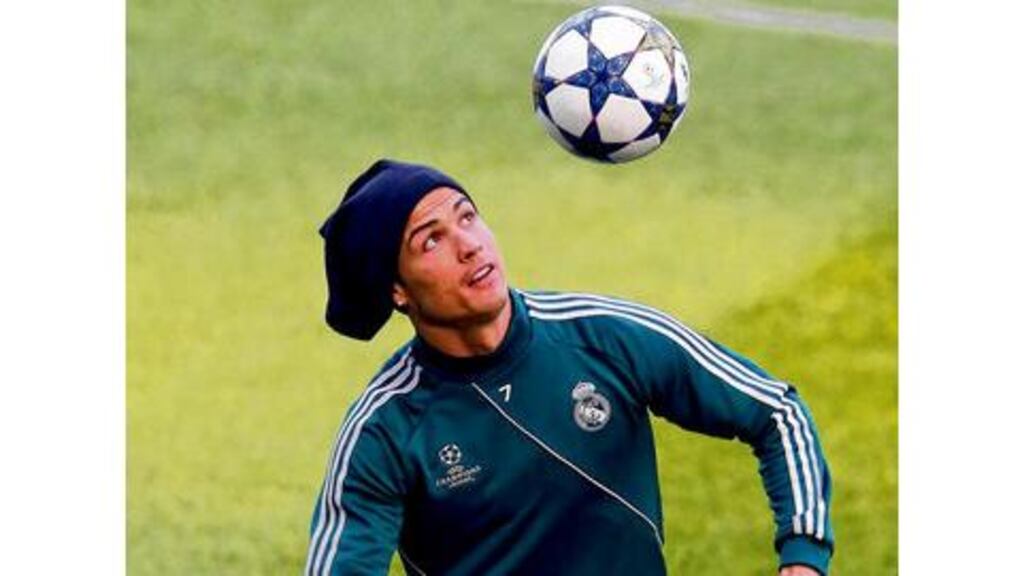 Cristiano Ronaldo keeps his eyes on the ball during yesterday's training session at the Etihad Stadium. Photograph: Alex Livesey/Getty Images