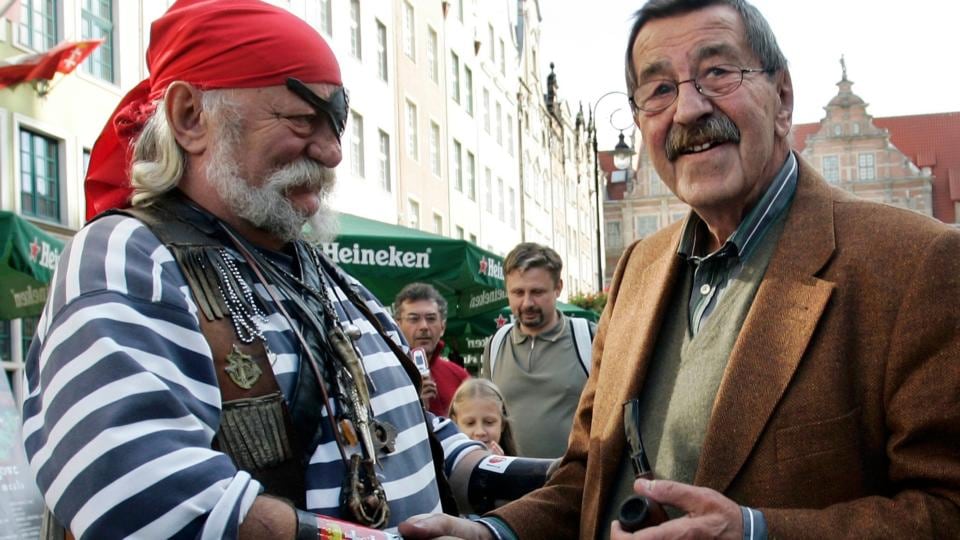 Günter Grass shakes hands with a man dressed as a pirate in the centre of Gdansk in October, 2007. Photograph: Krzysztof Mystkowski/KFP/ Reuters