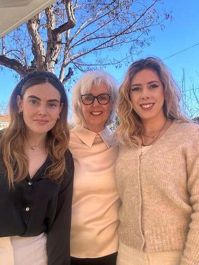 Claire Lambert with daughters, Marine and Lucy, in her garden