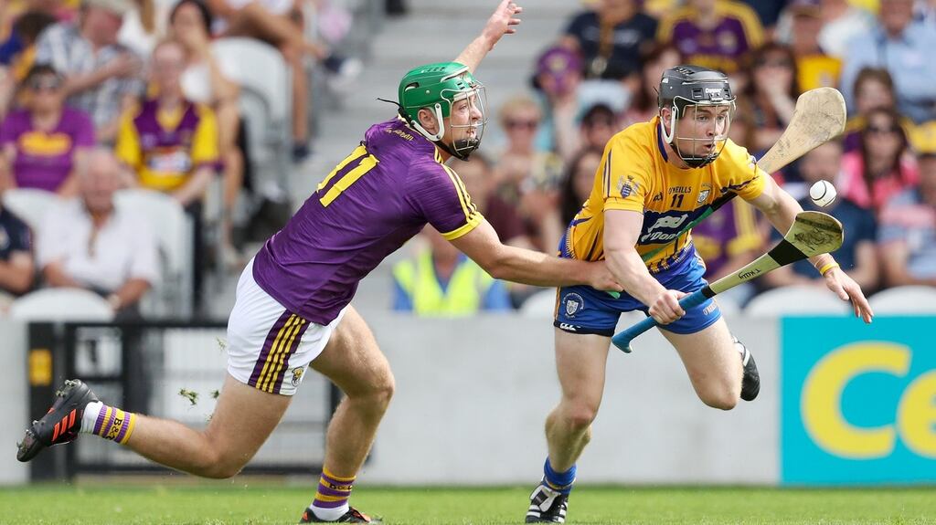 Clare’s Tony Kelly is challenged by Aidan Nolan of Wexford. Photograph: Tommy Dickson/Inpho